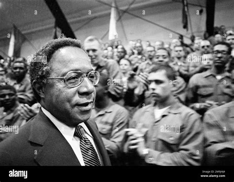 "Roots" author Alex Haley waks past applauding soldiers at Ft. Dix Army Base in N.J., April 26 ...