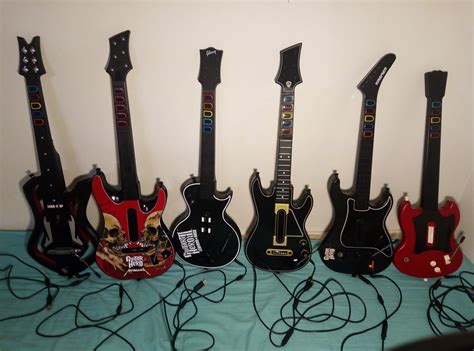 My guitar collection, all wired USB Xbox 360/PC. Three mod guitars (w/ xplorer guts) on right ...