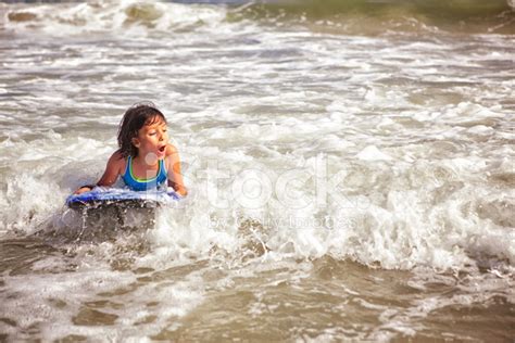 Child Boogie Boarding Stock Photo | Royalty-Free | FreeImages