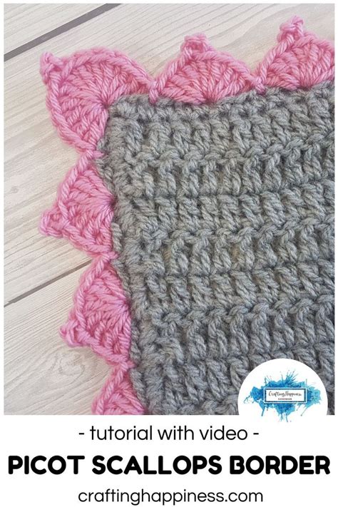 a crocheted square with pink and gray trim