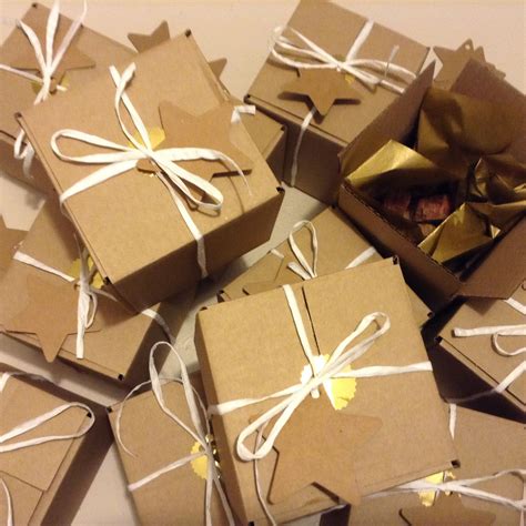 Homemade fudge gift boxes wrapped in simple brown paper boxes with gold ...