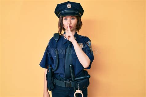 Young Beautiful Woman Wearing Police Uniform Asking To Be Quiet with ...