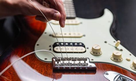 How to Restring an Electric Guitar (String Change Guide) - Music Grotto