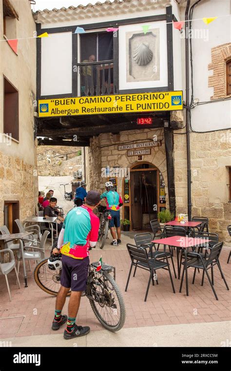 Pilgrims walking the Camino de Santiago pilgrimage route the way of St ...