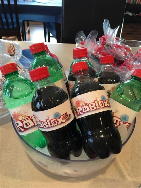 several bottles of soda sit in a bowl on a table