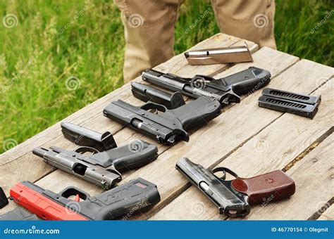 Portable guns on the table editorial stock image. Image of shooting - 46770154