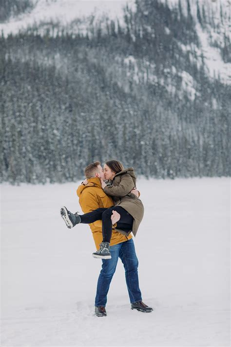 Lake Louise Vacation photos in winter with a snow fight in the mountains