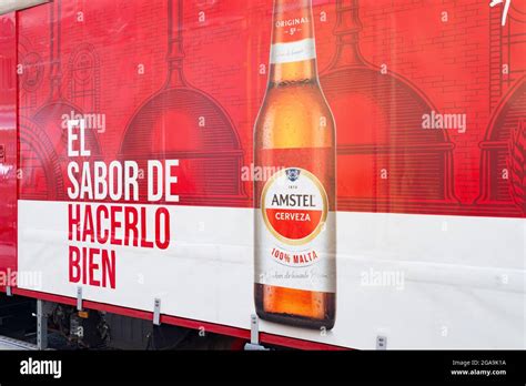 An Amstel beer logo next to a sign that says "the taste of doing it right" seen in Valencia ...