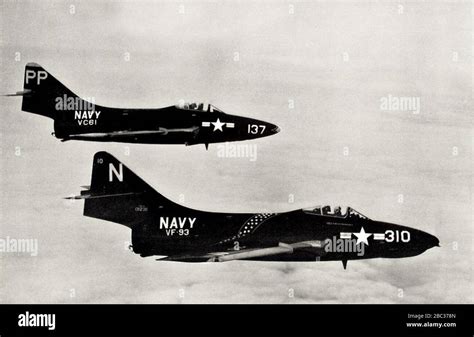 Grumman F9F-8B Cougar of VF-93 in flight with F9F-6P of VC-61, in 1956 Stock Photo - Alamy