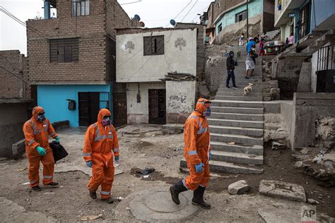 As virus swamps Peru, Venezuelan migrants collect the dead — AP Photos