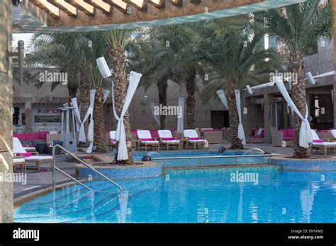 The swimming pool deck at the Shangri La hotel Dubai, Uae Stock Photo ...