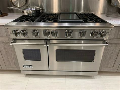 a stainless steel stove top oven in a kitchen