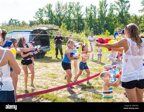 Children playing Water battle, water game battle Stock Photo - Alamy