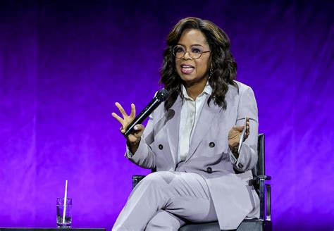 Oprah Winfrey Pops in Lavender for The Color Purple at CinemaCon 2023 – Footwear News