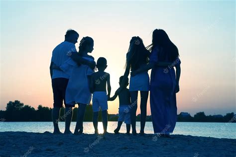 Premium Photo | Silhouette of family on sunset background