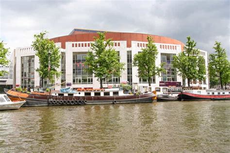 Amsterdam Walking Tour and Canal Cruise | GetYourGuide