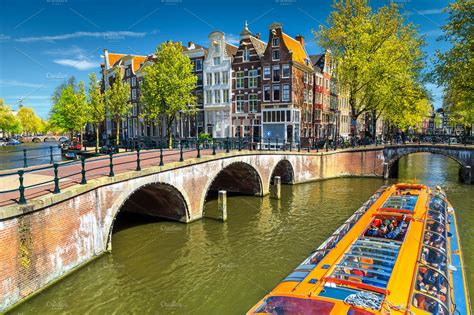 Amsterdam canals and bridges | Architecture Stock Photos ~ Creative Market