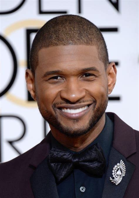 a close up of a person wearing a suit and bow tie