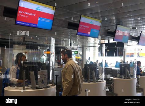 A passenger at the Sky Priority check in counter of KLM and Air France airlines at the KLM crown ...