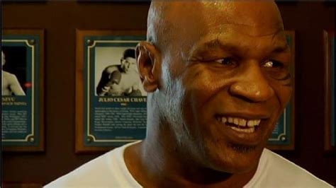 Mike Tyson smiles during his tour of the International Boxing Hall of ...