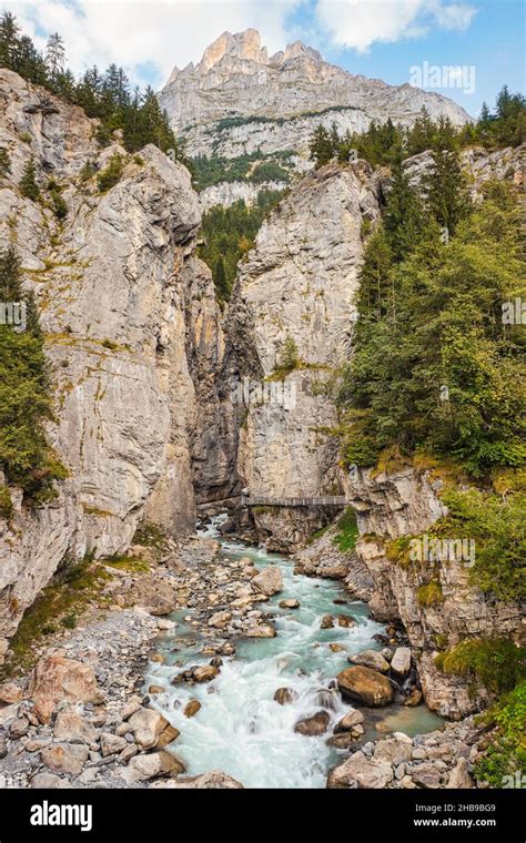 Grindelwald Glacier Canyon. Alpine mountain landscape with turquoise glacial river, glacier ...