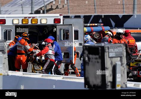 October 16, 20011: Izod Indycar Series driver Dan Wheldon is loaded into an ambulance after ...