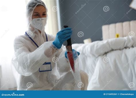 Investigator in Protective Suit Working at Crime Scene, Focus on Knife ...