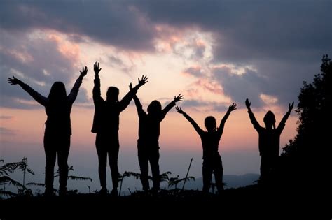 Free Photo | Group of happy people playing at summer sunset in nature