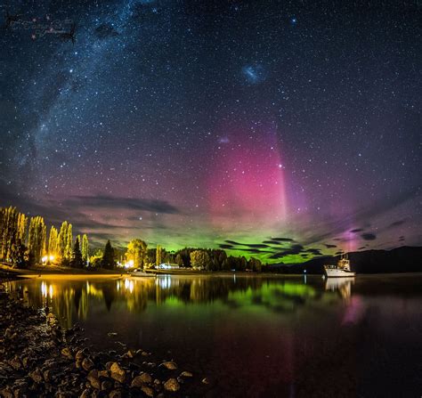 Te Anau, New Zealand, with the Aurora Australis lighting up the evening ...