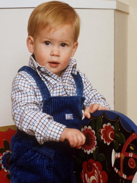 The young Prince plays on his rocking horse in a stylish pair of ...