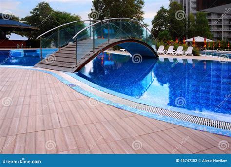 Swimming Pool with Bridge stock photo. Image of deck - 46747302