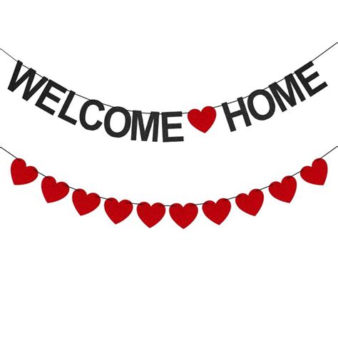 a welcome home banner with hearts hanging from it