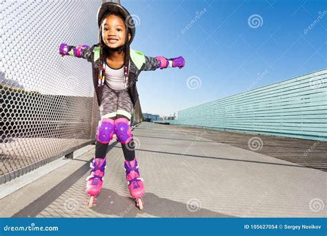 Girl in Roller Blades Doing Tricks at Skate Park Stock Photo - Image of girl, happy: 105627054