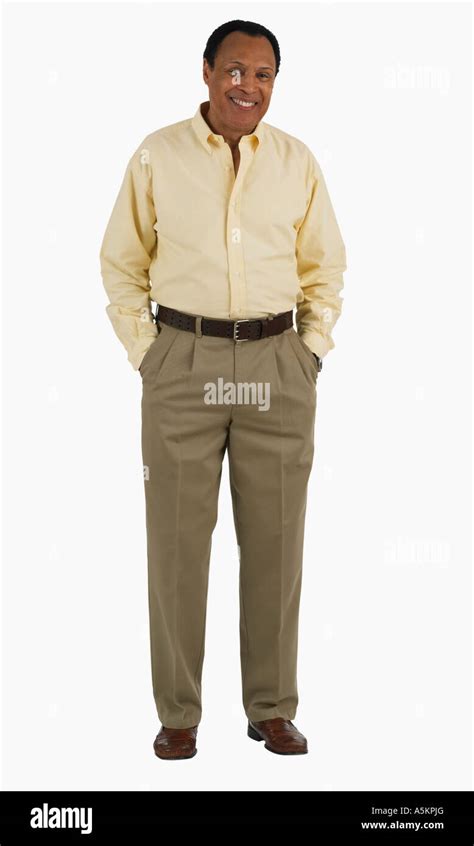 Studio shot of man with hands in pockets Stock Photo - Alamy