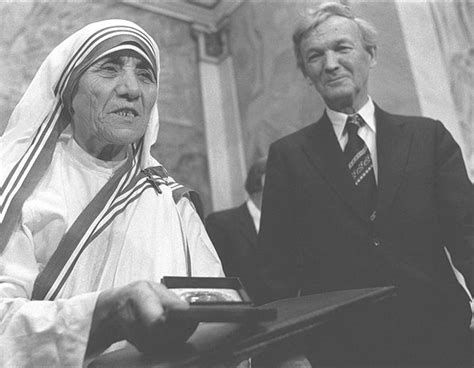 Mother Teresa receiving the Nobel Peace Prize medal and diploma during ...