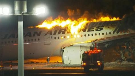 Hundreds of passengers escape after jet collides with small plane on its way to Japan quake zone ...