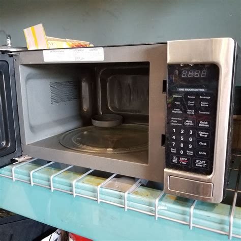 LG STAINLESS AND BLACK MICROWAVE - Big Valley Auction