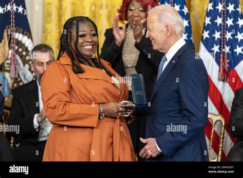 President Joe Biden presents the Presidential Citizens Medal to Shaye Moss, a Fulton County ...