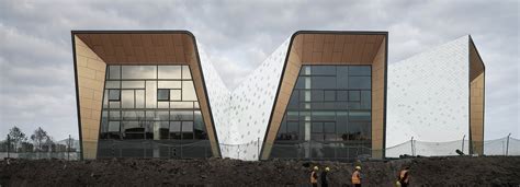 challenge design folds a metal façade over a kindergarten in china