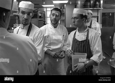 Chef Michel Roux jr at Le Gavroche discussing the day's menu with his sous chefs Stock Photo - Alamy