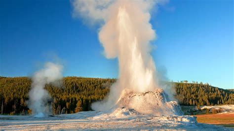 Castle Geyser erupting in early evening in Yellowstone's Upper Geyser Basin - Yellowstone ...