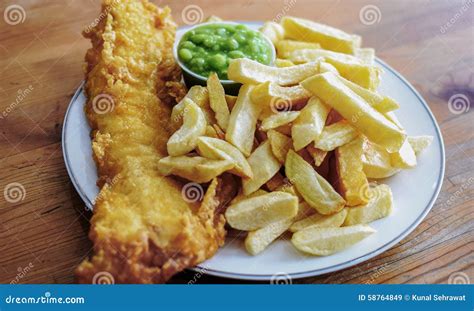 English Battered Cod Fish and Chips with Mushy Peas in a Plate Stock ...