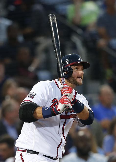 Atlanta Braves' A.J. Pierzynski watches his RBI single during the third inning of a baseball ...