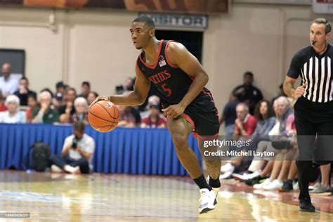 Lamont Butler of the San Diego State Aztecs dribbles up court during ...