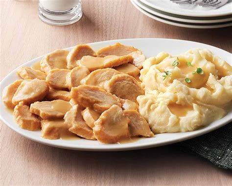 Our turkey with mashed potatoes has slow-roasted turkey tenderloins in a homestyle gravy with ...