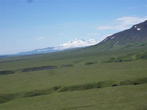 View to south from the northeast side of Umnak Island showing Recheshnoi and Vsevidof volcanoes ...