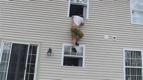 my brother jumping out a 2 story window - YouTube