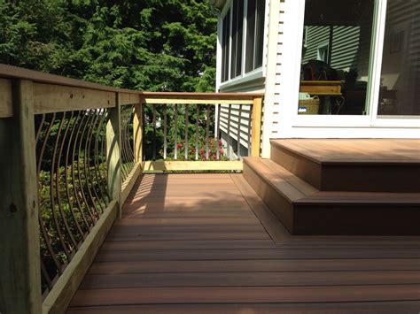 Composite Decking with Pressure Treated Railings. Composite Deck Board used as top rail dresses ...