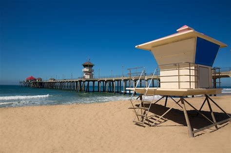 Premium Photo | Huntington beach pier surf city usa with lifeguard tower