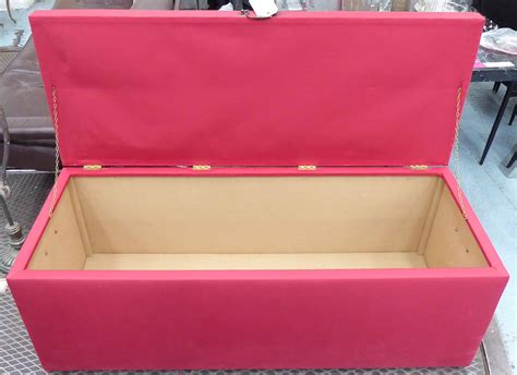 OTTOMAN STORAGE TRUNK, red upholstered, 55cm x 57cm H x 138cm.